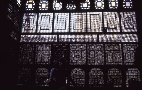 Mashrabiya or Shanasheel is the Arabic term given to a type of projecting oriel window enclosed with carved wood latticework located on the second storey of a building or higher; often lined with stained glass.  